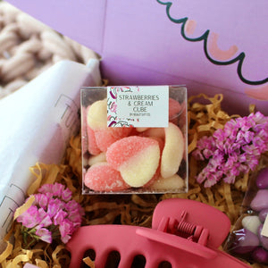 Pink soft and chewy hearts in a 80g candy cube box, gluten-free, perfect for sweetening up any Beaut Box.