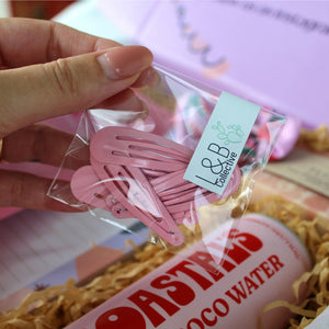 Lola & Boo Collective cute filler gift set with pink hair clips, mini elastic bands, and natural tone mini flower clips