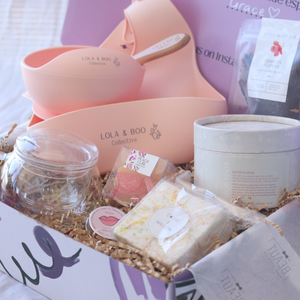 gift box for mum and bub featuring silicone feeder set, sweet treats and pamper items
