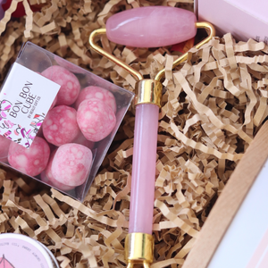 rose face roller, pink with gold trimming