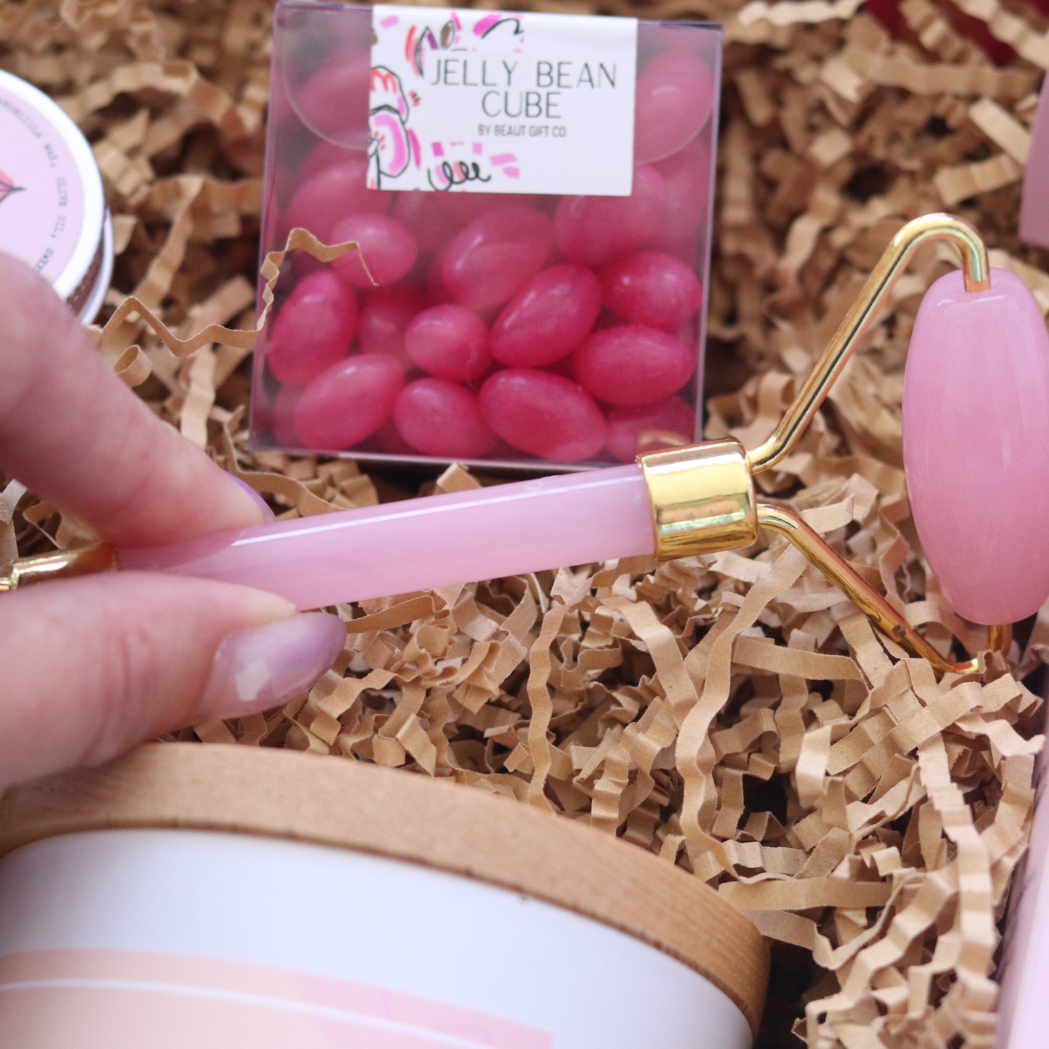 rose face roller, pink with gold trimming