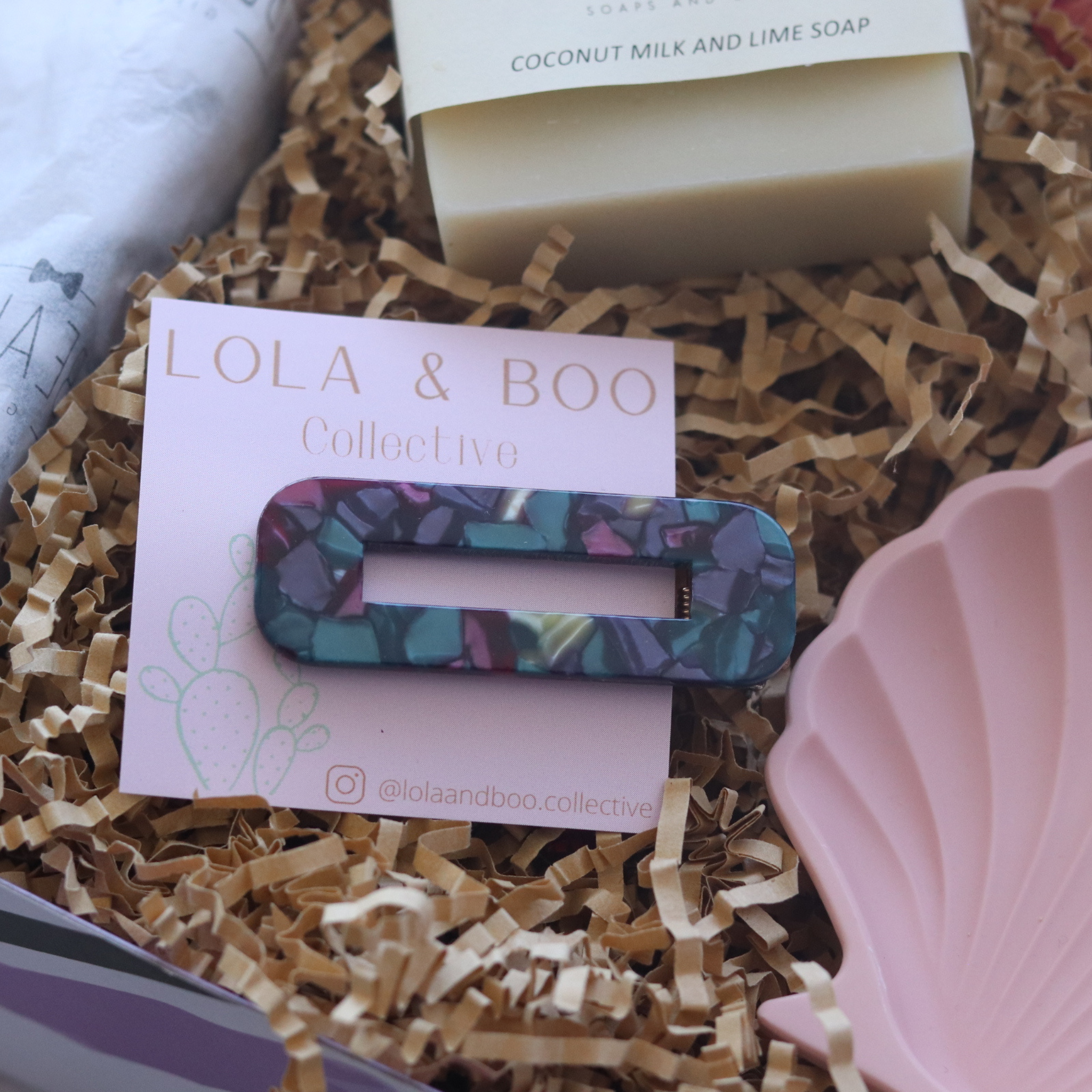 multicoloured lola and boo resin hairclip pictured in box