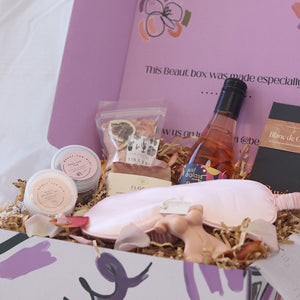 mothers day gift box including wine, pamper items and home decor and tea