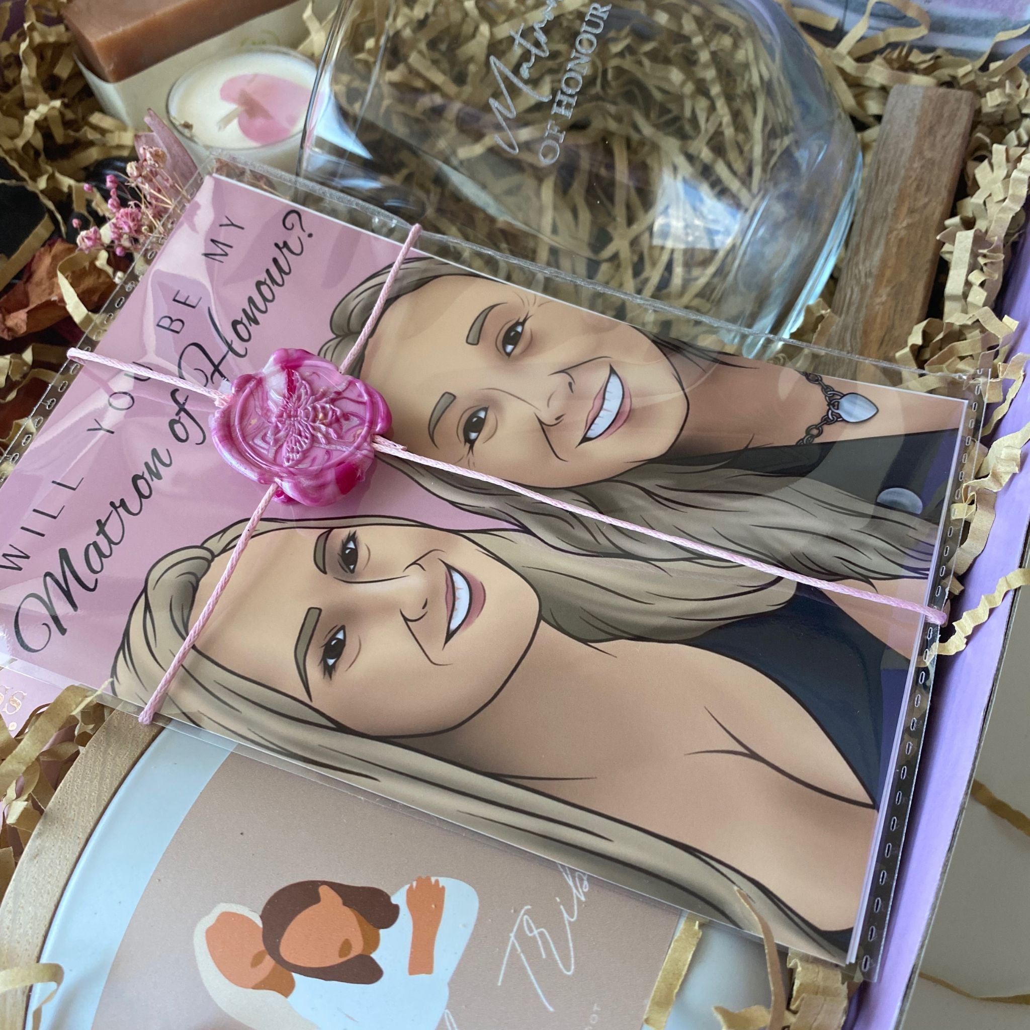 bride tribe candle in beaut box with other custom gifts such as a custom illustration and custom engraved wine glass made in sydney 