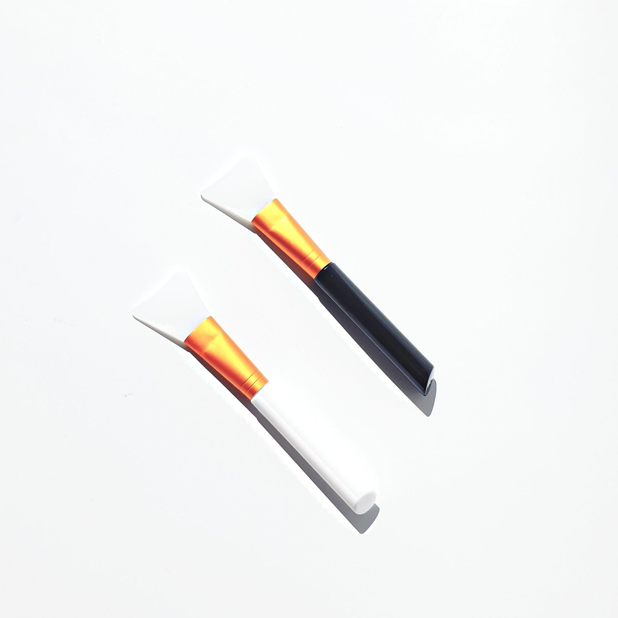 silicone face mask applicator in white and black