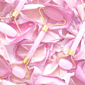 rose face roller, pink with gold trimming
