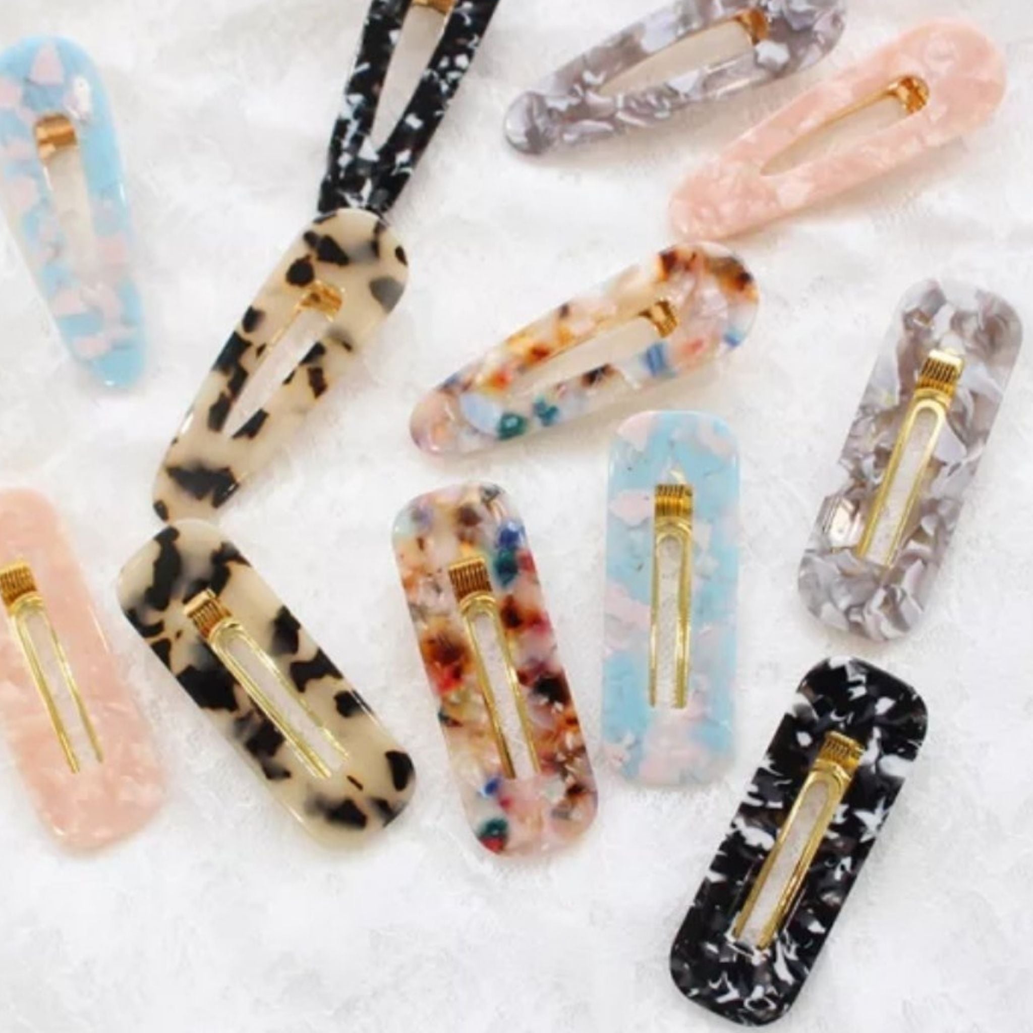 a combination of different colours of resin hair clips